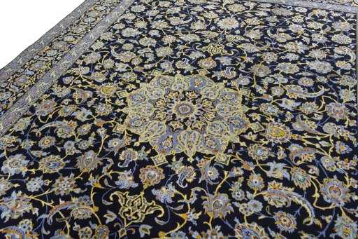 Backside of handmade 2000s Kashan rug showing knot structure and weave density