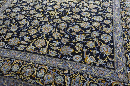 Close-up detail of 2000s Kashan rug from Iran / Persia showing Wool weave