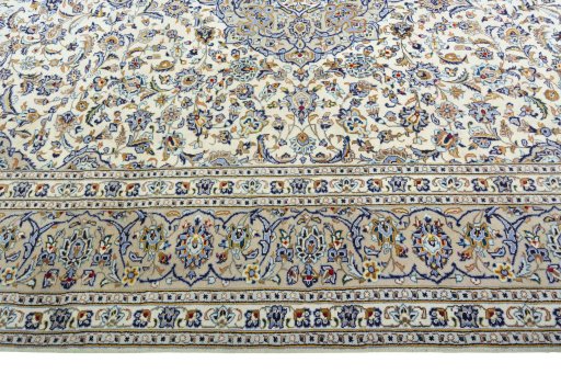 Corner detail of 2000s Kashan rug showing border pattern and Wool pile