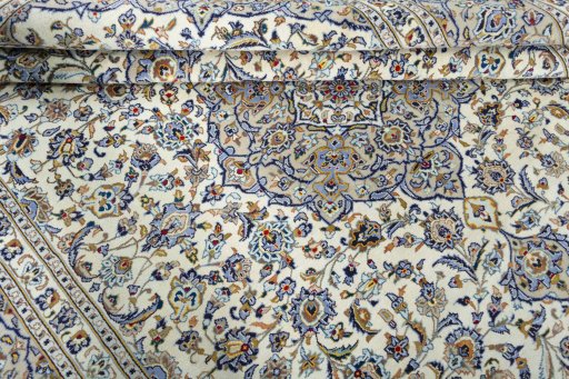 Close-up detail of 2000s Kashan rug from Iran / Persia showing Wool weave