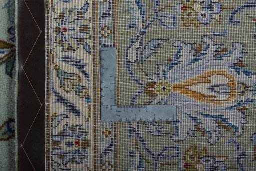 Backside of handmade 1970s Kashan rug showing knot structure and weave density