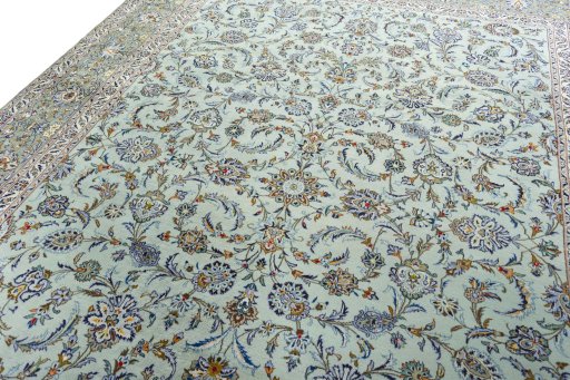 Backside of handmade 1970s Kashan rug showing knot structure and weave density