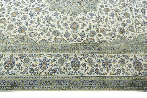 Corner detail of 2000s Kashan rug showing border pattern and Wool pile