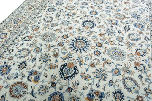 Backside of handmade 2000s Kashan rug showing knot structure and weave density