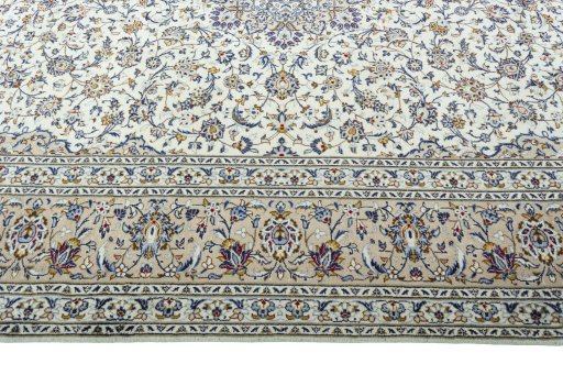 Corner detail of 2000s Kashan rug showing border pattern and Wool pile