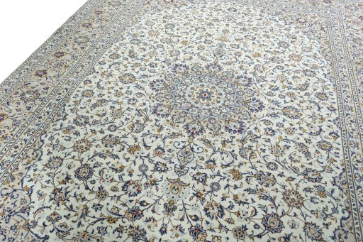 Backside of handmade 2000s Kashan rug showing knot structure and weave density