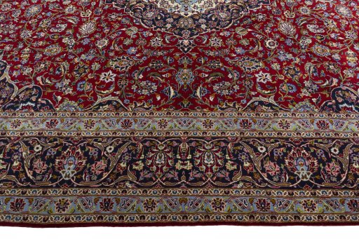 Corner detail of New Kashan rug showing border pattern and Wool pile