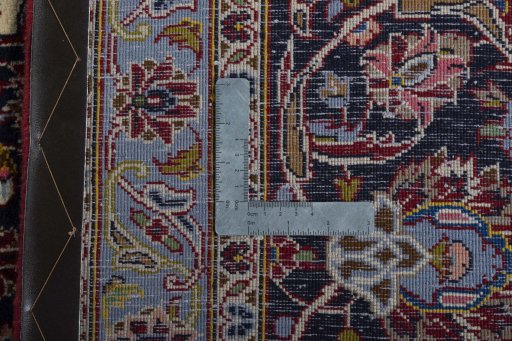 Backside of handmade New Kashan rug showing knot structure and weave density