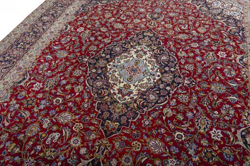 Backside of handmade New Kashan rug showing knot structure and weave density