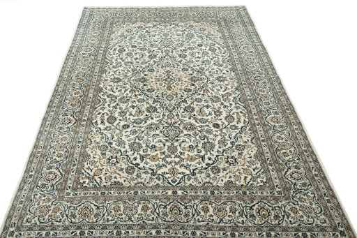Surface texture of 2000s Kashan rug with natural Wool and intricate pattern