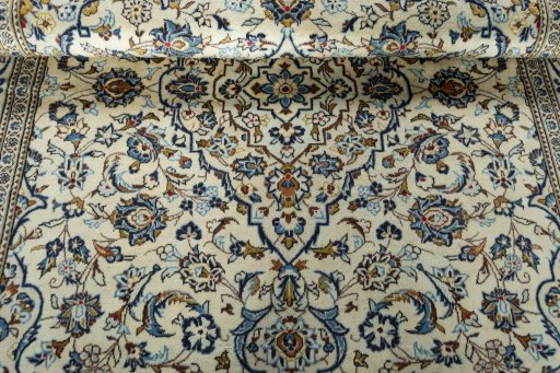 Close-up detail of 2000s Kashan rug from Iran / Persia showing Wool weave