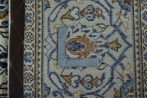 Backside of handmade 2000s Kashan rug showing knot structure and weave density