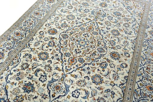 Backside of handmade 2000s Kashan rug showing knot structure and weave density