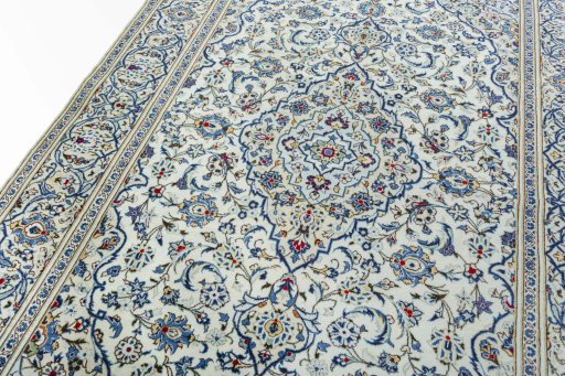Backside of handmade 2000s Kashan rug showing knot structure and weave density