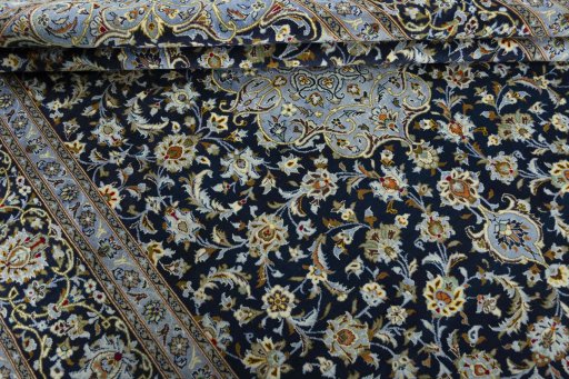 Close-up detail of 2000s Kashan rug from Iran / Persia showing Wool weave