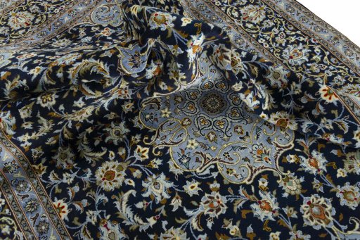 Surface texture of 2000s Kashan rug with natural Wool and intricate pattern