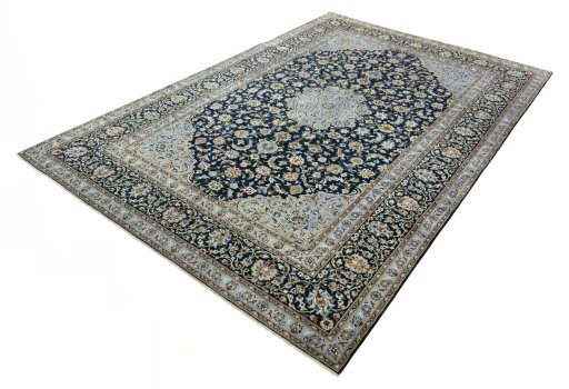 Corner detail of 2000s Kashan rug showing border pattern and Wool pile