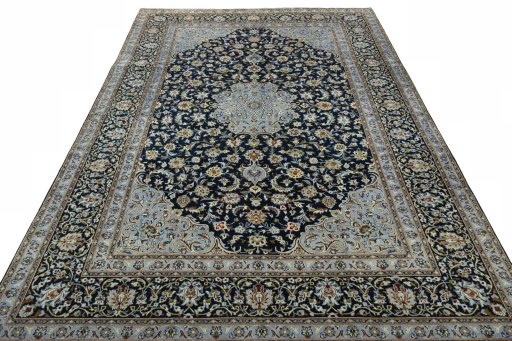 Surface texture of 2000s Kashan rug with natural Wool and intricate pattern