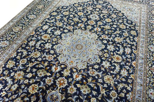 Backside of handmade 2000s Kashan rug showing knot structure and weave density