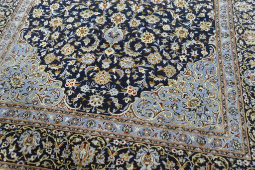 Close-up detail of 2000s Kashan rug from Iran / Persia showing Wool weave