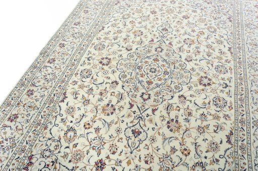 Backside of handmade 2000s Kashan rug showing knot structure and weave density