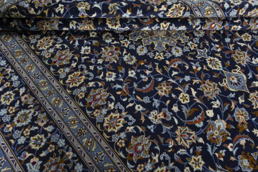 Close-up detail of 2000s Kashan rug from Iran / Persia showing Wool weave