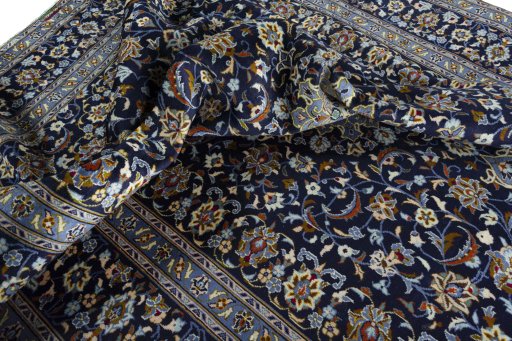 Surface texture of 2000s Kashan rug with natural Wool and intricate pattern