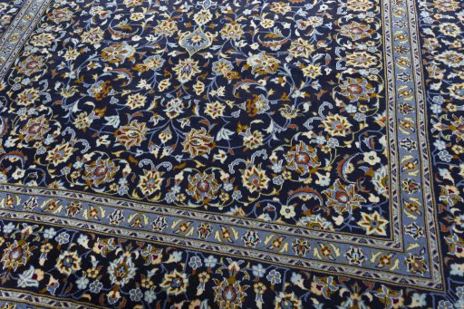 Close-up detail of 2000s Kashan rug from Iran / Persia showing Wool weave