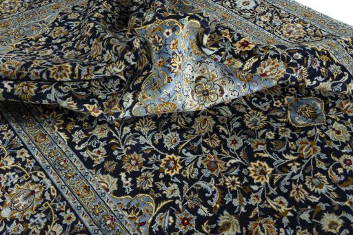 Surface texture of 2000s Kashan rug with natural Wool and intricate pattern
