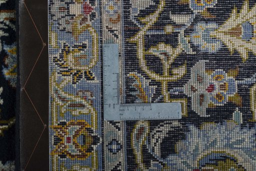 Backside of handmade 2000s Kashan rug showing knot structure and weave density