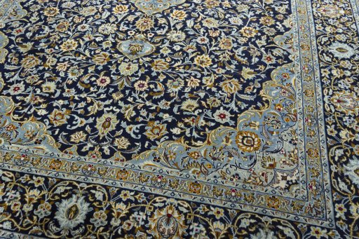 Close-up detail of 2000s Kashan rug from Iran / Persia showing Wool weave