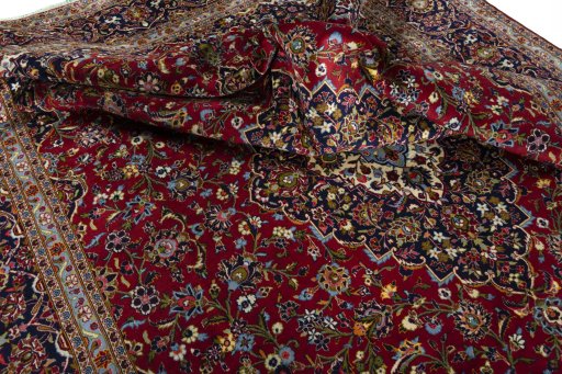 Surface texture of 2000s Kashan rug with natural Cork and intricate pattern