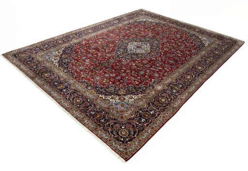Corner detail of 2000s Kashan rug showing border pattern and Cork pile