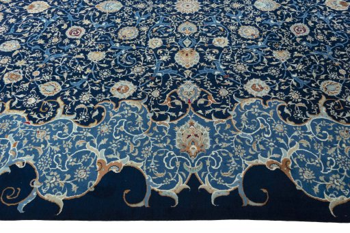 Corner detail of 2000s Kashan rug showing border pattern and Wool pile