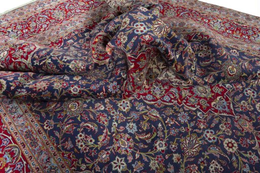 Surface texture of 2000s Kashan rug with natural Cork and intricate pattern