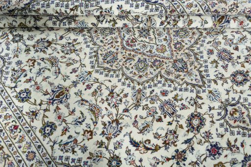 Close-up detail of 2000s Kashan rug from Iran / Persia showing Wool weave