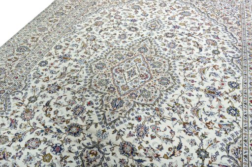 Backside of handmade 2000s Kashan rug showing knot structure and weave density