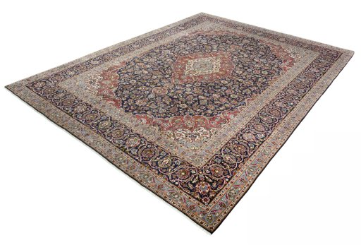 Corner detail of 2000s Kashan rug showing border pattern and Cork pile