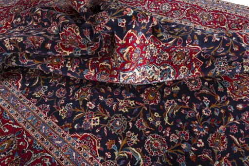 Surface texture of 2000s Kashan rug with natural Wool and intricate pattern