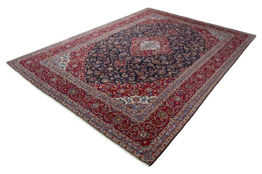 Corner detail of 2000s Kashan rug showing border pattern and Wool pile