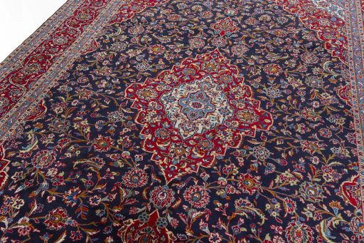 Backside of handmade 2000s Kashan rug showing knot structure and weave density