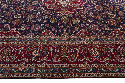 Corner detail of 1970s Kashan rug showing border pattern and Wool pile