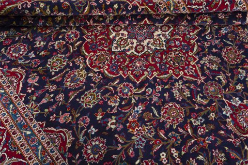 Close-up detail of 1970s Kashan rug from Iran / Persia showing Wool weave