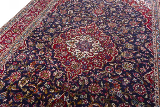 Backside of handmade 1970s Kashan rug showing knot structure and weave density