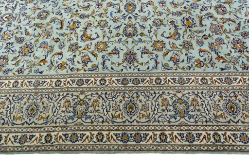 Corner detail of 2000s Kashan rug showing border pattern and Wool pile