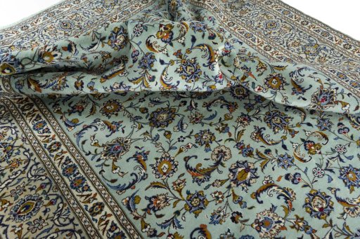 Surface texture of 2000s Kashan rug with natural Wool and intricate pattern