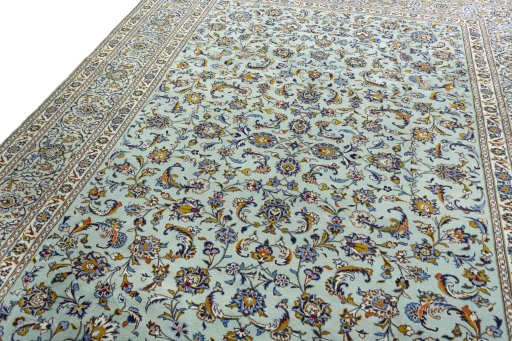Backside of handmade 2000s Kashan rug showing knot structure and weave density