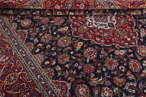 Close-up detail of 2000s Kashan rug from Iran / Persia showing Wool weave