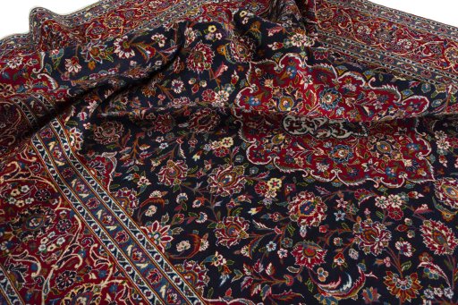 Surface texture of 2000s Kashan rug with natural Wool and intricate pattern