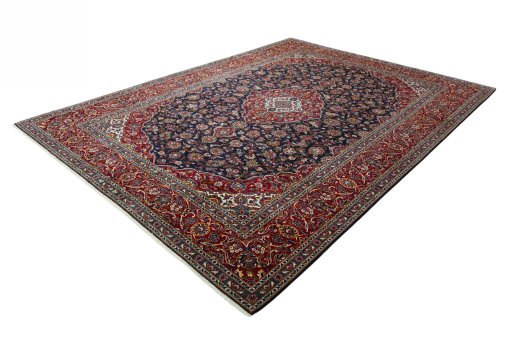 Corner detail of 2000s Kashan rug showing border pattern and Wool pile